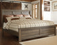 Juararo King Panel Bed with Mirrored Dresser and 2 Nightstands